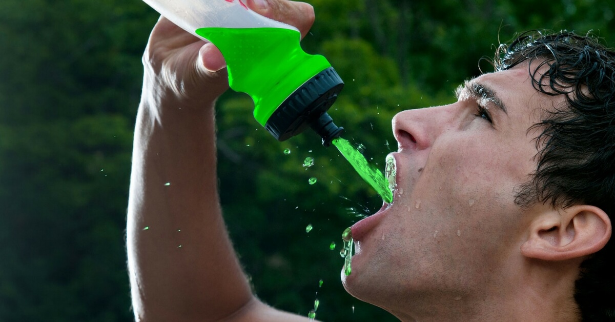 man drinking staminade sports drink