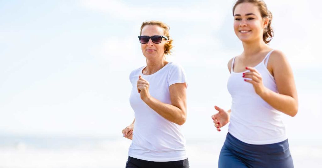 2 women in white running